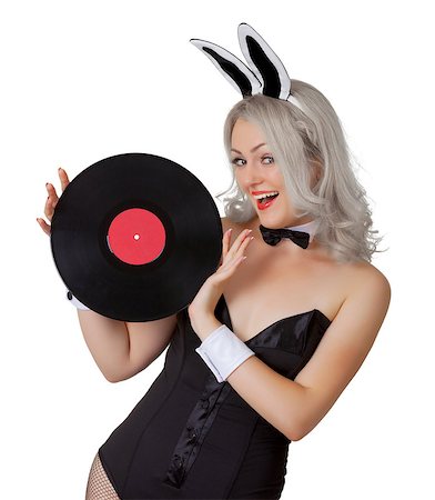 Playful blonde in a bunny suit with a vinyl record in the hands isolated on white background Stock Photo - Budget Royalty-Free & Subscription, Code: 400-07092811