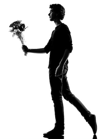 simsearch:400-07097695,k - young man offering flowers bouquet silhouette in studio isolated on white background Stock Photo - Budget Royalty-Free & Subscription, Code: 400-07093060