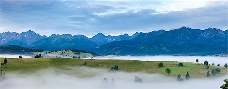 Summer sunrise mountain village outskirts with fog and Tatra range  (Gliczarow Gorny, Poland) Stock Photo - Budget Royalty-Free & Subscription, Code: 400-07093342