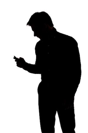 Man texting with one hand in silhouette isolated over white background Stock Photo - Budget Royalty-Free & Subscription, Code: 400-07093432