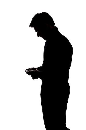 Man texting with two hands in silhouette isolated over white background Stock Photo - Budget Royalty-Free & Subscription, Code: 400-07093433