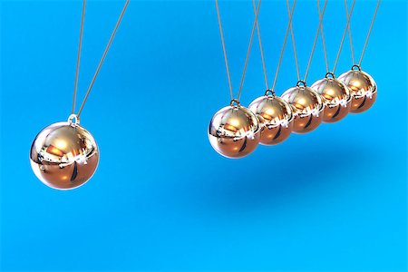 simsearch:400-05282436,k - A Colourful 3d Rendered Newtons Cradle Illustration on a Blue Background Fotografie stock - Microstock e Abbonamento, Codice: 400-07104076
