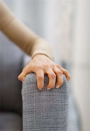 stressed housewife - Closeup on hand of stressed woman sitting on sofa Stock Photo - Budget Royalty-Free & Subscription, Code: 400-07104796