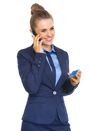 simsearch:400-07106831,k - Smiling business woman with credit card talking cell phone Stockbilder - Microstock & Abonnement, Bildnummer: 400-07105129