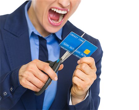 Closeup on angry business woman cutting credit card with scissors Stock Photo - Budget Royalty-Free & Subscription, Code: 400-07105131