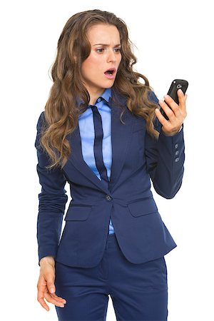 simsearch:400-07106831,k - Surprised business woman looking on cell phone Stockbilder - Microstock & Abonnement, Bildnummer: 400-07106788