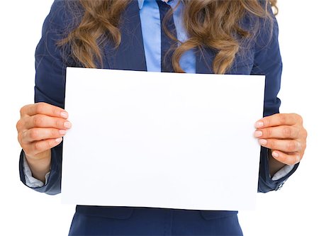 simsearch:400-06139245,k - Closeup on business woman showing blank paper sheet Foto de stock - Royalty-Free Super Valor e Assinatura, Número: 400-07106840