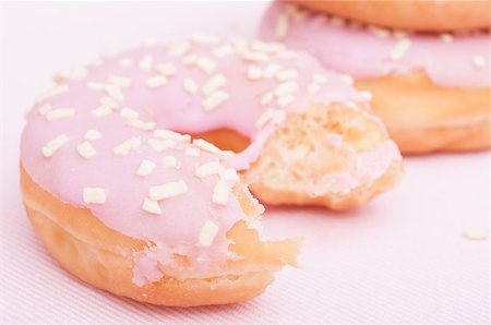 simsearch:400-06524508,k - Closeup of Homemade Donuts with Pink Icing - Shallow Depth of Field Stock Photo - Budget Royalty-Free & Subscription, Code: 400-07100113