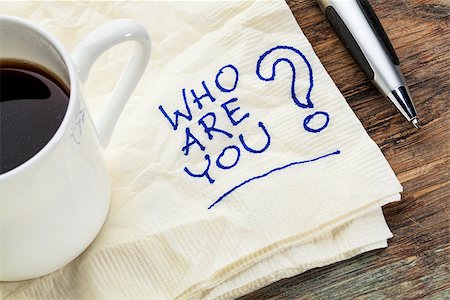 who are you question on a napkin with a cup of coffee Stock Photo - Budget Royalty-Free & Subscription, Code: 400-07100130