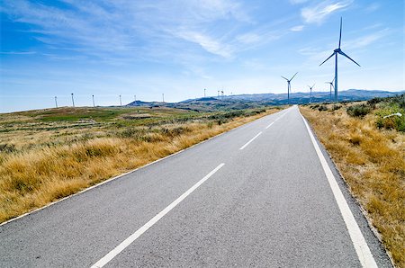 Asphalt road through a wind turbines mountain field. Stock Photo - Budget Royalty-Free & Subscription, Code: 400-07100390