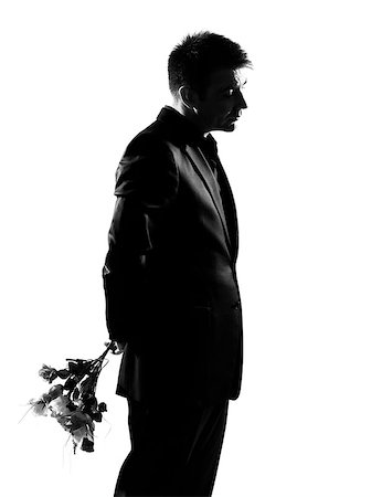 simsearch:400-07097695,k - silhouette caucasian business man offering flowers expressing behavior full length on studio isolated white background Stock Photo - Budget Royalty-Free & Subscription, Code: 400-07100728