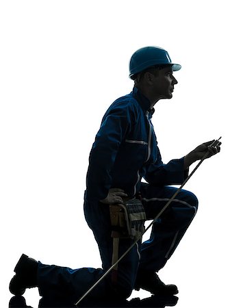 one caucasian man construction worker silhouette in studio on white background Stock Photo - Budget Royalty-Free & Subscription, Code: 400-07100845