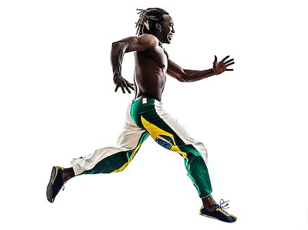 rastafarian - one brazilian  black man running jumping on white background Stock Photo - Budget Royalty-Free & Subscription, Code: 400-07101468