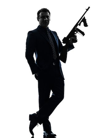 simsearch:400-07097770,k - one caucasian man holding thompson machine gun  in silhouette on white background Photographie de stock - Aubaine LD & Abonnement, Code: 400-07101497