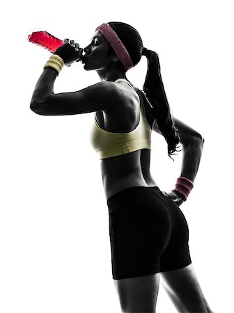 one  woman exercising fitness drinking energy drink  in silhouette  on white background Stock Photo - Budget Royalty-Free & Subscription, Code: 400-07101513