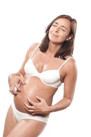 caucasian pregnant woman itching isolated studio on white background Photographie de stock - Aubaine LD & Abonnement, Code: 400-07101570