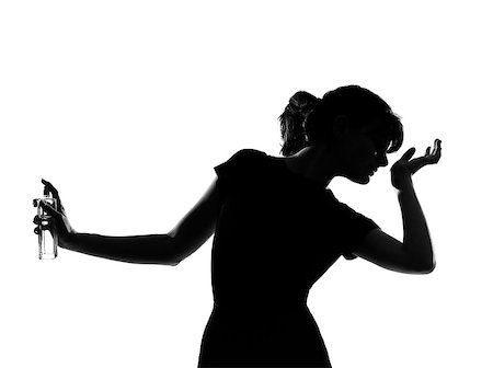 portrait silhouette in shadow of a one young woman smelling perfume  in studio on white background isolated Photographie de stock - Aubaine LD & Abonnement, Code: 400-07101676