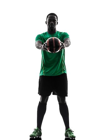 one african man soccer player green jersey holding showing football  in silhouette  on white background Stock Photo - Budget Royalty-Free & Subscription, Code: 400-07103008