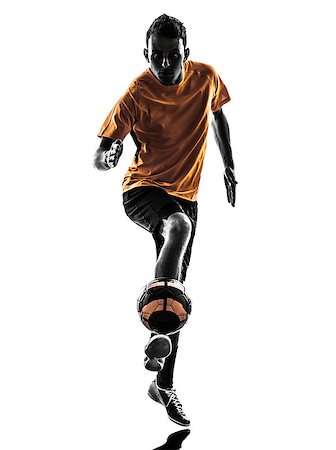 football man kicking white background - one caucasian young man soccer player orange jersey in silhouette  on white background Stock Photo - Budget Royalty-Free & Subscription, Code: 400-07103137