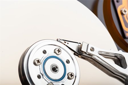 Opened computer hard drive closeup top view photo Fotografie stock - Microstock e Abbonamento, Codice: 400-07103636