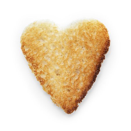 toasted slice of white bread heart shape, on white background with shadow Stock Photo - Budget Royalty-Free & Subscription, Code: 400-07114060