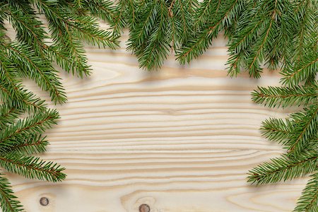 christmas background from fir twigs on wooden table, horizontal Stock Photo - Budget Royalty-Free & Subscription, Code: 400-07114086