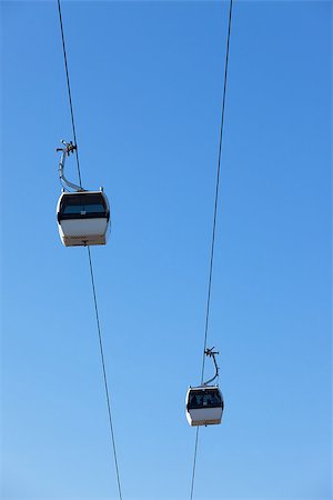 portugal pillar - Cable car on blue sky background, in Expo district, Lisbon, Portugal Stock Photo - Budget Royalty-Free & Subscription, Code: 400-07114710