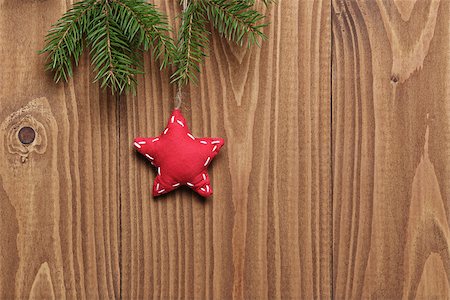 vintage christmas decorative star hanging, spruce twig on wood plank Stock Photo - Budget Royalty-Free & Subscription, Code: 400-07115596