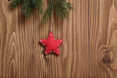 vintage christmas decorative star hanging, spruce twig on wood plank Stock Photo - Budget Royalty-Free & Subscription, Code: 400-07115597