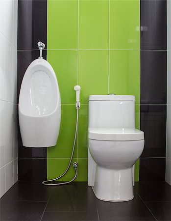 simsearch:400-04835835,k - Toilet in gray and green tiled bathroom Fotografie stock - Microstock e Abbonamento, Codice: 400-07115787