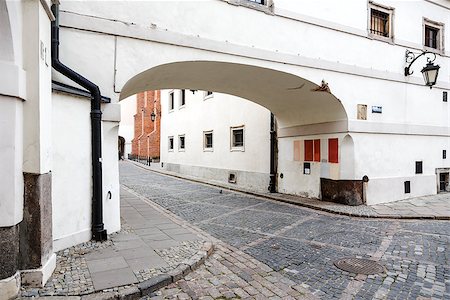 Archway from the street Kanonia into street Dziekania at the old town in Warsaw Stock Photo - Budget Royalty-Free & Subscription, Code: 400-07116365