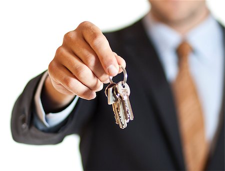 realtor (male) - Businessman handing you the keys Stock Photo - Budget Royalty-Free & Subscription, Code: 400-07110918