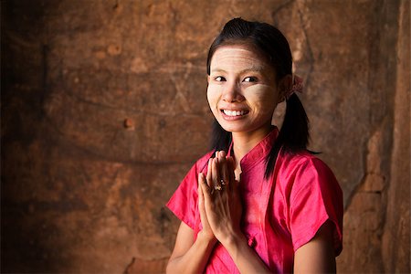 photographic portraits poor people - Myanmar girl in a traditional welcoming gesture Stock Photo - Budget Royalty-Free & Subscription, Code: 400-07111197