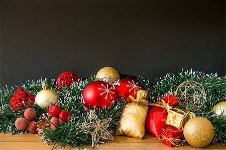 red ribbon and plant - christmas decoration over dark background Stock Photo - Budget Royalty-Free & Subscription, Code: 400-07111395