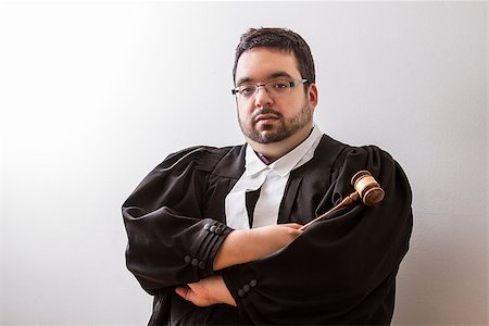Overweight man in canadian lawyer toga, with arms cross, holding a gavel in his hand Stock Photo - Budget Royalty-Free & Subscription, Code: 400-07111547