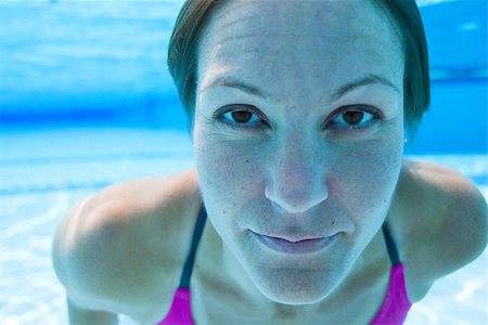 Closeup of face of female swimmer underwater in swimming pool Stock Photo - Budget Royalty-Free & Subscription, Code: 400-07112129
