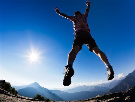 rcaucino (artist) - Man jumping in the sunshine against blue sky. Concept: freedom, success, energy, vitality. Photographie de stock - Aubaine LD & Abonnement, Code: 400-07112201