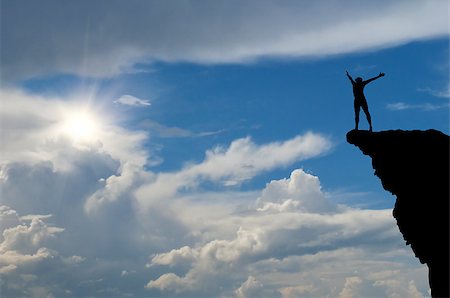 simsearch:400-07208717,k - man on top of the mountain reaches for the sun Photographie de stock - Aubaine LD & Abonnement, Code: 400-07112248