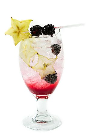 simsearch:400-06797125,k - cocktail served in a chalice garnished with a carambola slice and blackberries isolated on a white background Stock Photo - Budget Royalty-Free & Subscription, Code: 400-07112368