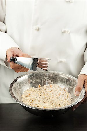 simsearch:400-07615342,k - Close-up of a pastry chef preparing a crust, cleaning crumber Stock Photo - Budget Royalty-Free & Subscription, Code: 400-07112600