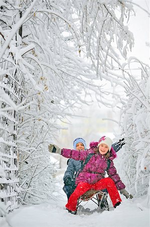 funny freezing cold photos - Kids sliding in winter time Stock Photo - Budget Royalty-Free & Subscription, Code: 400-07112742