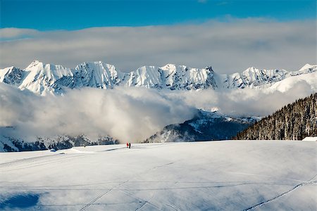 Panoramic View on Mountains and Two People Walking in French Alps in Winter Foto de stock - Royalty-Free Super Valor e Assinatura, Número: 400-07112782