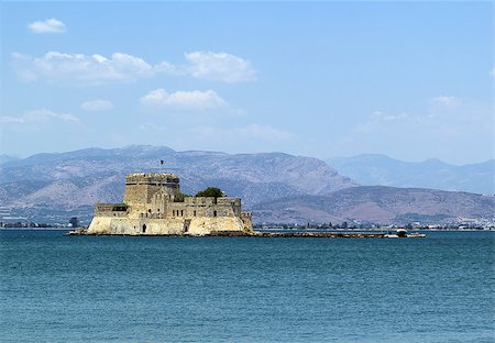 simsearch:400-04896968,k - The castle of Bourtzi is located in the middle of the harbour of Nafplio. The Venetians completed its fortification in 1473 Photographie de stock - Aubaine LD & Abonnement, Code: 400-07113030
