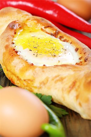 fried egg and pepper - Flan with cheese and eggs on a wooden table. Stock Photo - Budget Royalty-Free & Subscription, Code: 400-07113365