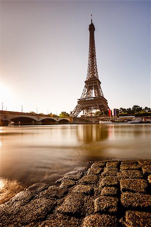 eifel - Eiffel Tower and Cobbled Embankment of Seine River at Sunrise, Paris, France Fotografie stock - Microstock e Abbonamento, Codice: 400-07113658