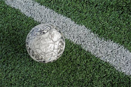 simsearch:400-05118067,k - Artificial grass soccer field and old football Stock Photo - Budget Royalty-Free & Subscription, Code: 400-07113685
