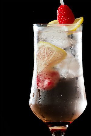 simsearch:400-06797125,k - raspberry lemonade served in a stemmed glass on a dark bar Stock Photo - Budget Royalty-Free & Subscription, Code: 400-07113804