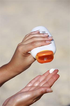 close up of women hands receiving sunblock cream lotion Stock Photo - Budget Royalty-Free & Subscription, Code: 400-07124162