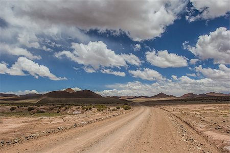 Dirt road in Argentina against blue sky. Stock Photo - Budget Royalty-Free & Subscription, Code: 400-07124203