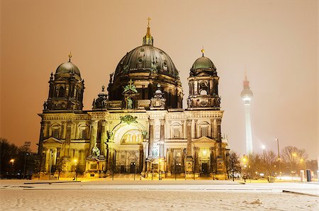 The Berlin Cathedral in winter. The famous television tower can be seen on the right hand side. Stockbilder - Microstock & Abonnement, Bildnummer: 400-07124395